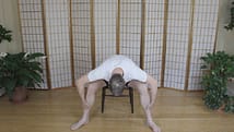 Seated forward bend stretch for the lower back.