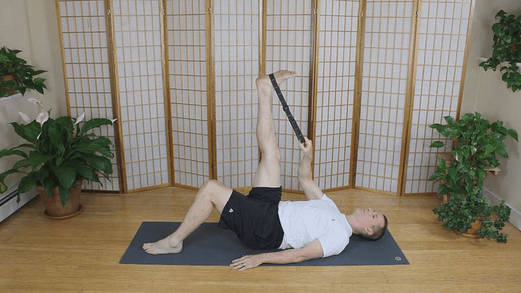Hamstrings stretch using Active Isolated Stretching and a yoga strap